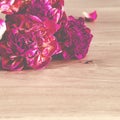 Flowers. A bouquet of lilac peonies lies on a wooden background