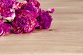 Flowers. A bouquet of lilac peonies lies on a wooden background