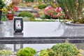 Flowers and candle on tomb in churchyard Royalty Free Stock Photo