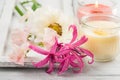 Flowers and candles on old wooden background Royalty Free Stock Photo