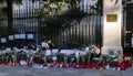 Flowers, candles and signs against terrorist attack in Paris, placed in front of French embassy in Madrid, Spain