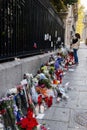 Flowers, candles and signs against terrorist attack in Paris, placed in front of French embassy in Madrid, Spain