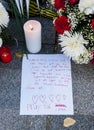 Flowers, candles and signs against terrorist attack in Paris, placed in front of French embassy in Madrid, Spain