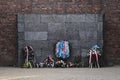 Flowers and candles by the Wall of Death, Auschwitz