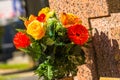 Flowers in a cemetery with tombstones in background Royalty Free Stock Photo