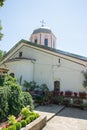 Flowers and church at the monastery of St. Nicholas Royalty Free Stock Photo