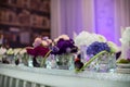 Flowers closeup at wedding reception table in purple