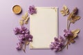 Flowers composition, blank paper sheet, golden frame, dried flowers on purple background Royalty Free Stock Photo