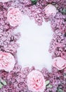 Flowers composition. Frame and lilac flowers of lilac and delicate pink peonies on a gray rough background. Royalty Free Stock Photo