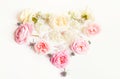 Flowers composition. Frame made of English rose flowers in the shape of a heart on white background. Flat lay, top view Royalty Free Stock Photo