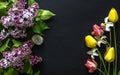 Flowers composition. Frame made of fresh spring flowers on dark background