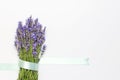 Flowers composition. Fresh bouquet of purple lavender with festive ribbon on light gray background. Flat lay top view copy space. Royalty Free Stock Photo