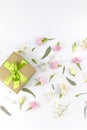 Flowers composition. Gifts and rose flowers on white wooden table. Women Day. Flat lay, top view, copy space Royalty Free Stock Photo
