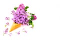 Flowers composition. Lilac in waffle cone. Flat lay, top view, copy space. Concept of proposal, attraction, gratitude