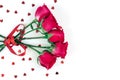 Flowers composition. Pink rose flowers and confetti in shape of heart against white background Royalty Free Stock Photo