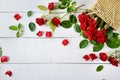 Flowers composition. Red roses on a white wooden background. Fla