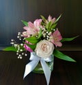 Flowers cute bouquet with roses and alstroemerias pink white green, wooden box