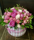 Flowers cute bouquet with roses and alstroemerias pink white green, wooden box