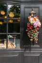 Flowers decorated on the lamp with black painted wooden wall in background Royalty Free Stock Photo