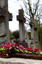 Flowers in a Cemetery on a cross, Pere Lachaise Paris, France