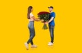 Flowers Delivery Courier Giving Woman Bouquet Of Roses, Yellow Background