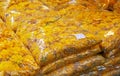 Sacks of yellow ornamental flowers in Bangkok, Thailand.