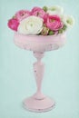 Flowers in an elegant pink tall vase