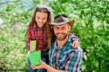 Flowers expert. ecology environment. soils and fertilizers. little girl and happy man dad. earth day. new life. family Royalty Free Stock Photo