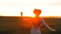 Flowers in the field. Girl in the field. Paganism. Sunset