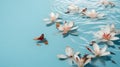 Flowers floating on blue water surface with petals falling down. Royalty Free Stock Photo