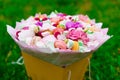 Flowers, fruit bouquet, pink carnation, marshmallows, macaroons, nature Royalty Free Stock Photo