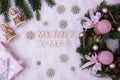 Flowers, a gift, a Christmas wreath, and the words Royalty Free Stock Photo
