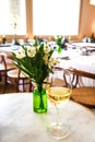 Flowers and glass of white wine Royalty Free Stock Photo