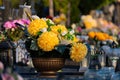 Flowers on the grave in autumn