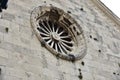 Flowers growing luxuriantly over the main entrance to church in Old Omis city, Dalmatia, Croatia Royalty Free Stock Photo