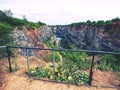 Flowers at handrail above old closed mine. Memory to victims