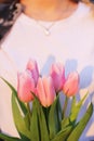 Flowers in the hands of a girl. Tulips in spring