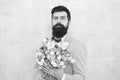 Flowers for her. Man bearded suit bow tie hold tulips bouquet. Gentleman making romantic surprise for her. Flowers