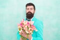 Flowers for her. Man bearded suit bow tie hold tulips bouquet. Gentleman making romantic surprise for her. Flowers Royalty Free Stock Photo