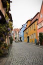 Flowers on houses on colorful street in Germany