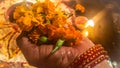 Flowers Kept In Hand For Worship. Goddess Lakshmi Puja. Background Blur.