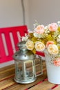 Flowers and lamps on a wooden table