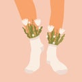 Flowers and leaves in socks on a pair of female legs. Summer bouquet aesthetic. Blossoms and high socks. Modern floral