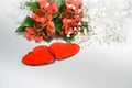 Flowers lily in color of the year 2019 - Living Coral. Livingcoral. Romantic bouquet and two red hearts for Valentines day dinner