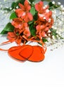 Flowers lily in color of the year 2019 - Living Coral. Livingcoral. Romantic bouquet and two red hearts for Valentines day dinner