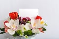 Flowers mock up congratulation. Congratulations card in bouquet flowers on white background. Blank card with space for text, frame Royalty Free Stock Photo