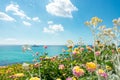 Flowers and motor yacht. Blue turquois sea water and sky Royalty Free Stock Photo
