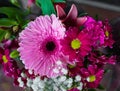 Flowers are near a flower shop on a city street. Beautiful bouquets of various flowers are presented in a flower shop Royalty Free Stock Photo