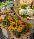 Flowers are near a flower shop on a city street. Beautiful bouquets of various flowers are presented in a flower shop Royalty Free Stock Photo