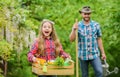 Flowers need good care. ecology. Gardening tools. little girl and happy man dad. earth day. spring village country Royalty Free Stock Photo